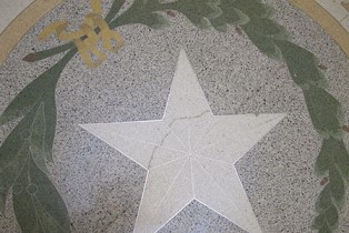 Close up of a crack in the star etching on the Capitol Rotunda floor.