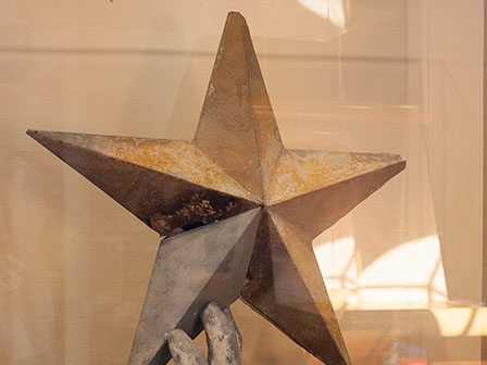 Row 9. Image 1994. close up of the Goddess of Liberty star on display at the CVC.